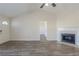 The living room has high ceilings, hardwood floors, and a fireplace at 11139 Silver Aspen Ct, Hampton, GA 30228
