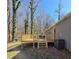 Wooden deck overlooking backyard with wooded scenery at 2308 Baywood Se Dr, Atlanta, GA 30315