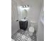 Bathroom with black and white patterned tile floor, black vanity, and vessel sink at 2308 Baywood Se Dr, Atlanta, GA 30315