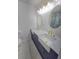 Elegant bathroom featuring dual farmhouse sinks, granite countertops, and modern lighting at 2308 Baywood Se Dr, Atlanta, GA 30315