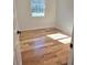 Sunny bedroom with hardwood floors and a large window providing natural light at 2308 Baywood Se Dr, Atlanta, GA 30315