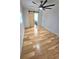 Bedroom featuring hardwood floors, a large ceiling fan, and a sliding barn door at 2308 Baywood Se Dr, Atlanta, GA 30315