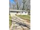 Charming single-story home with a gray exterior, a front porch, and a driveway at 2308 Baywood Se Dr, Atlanta, GA 30315