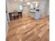 View of the open floor plan showcasing the kitchen and dining area with hardwood flooring at 2308 Baywood Se Dr, Atlanta, GA 30315