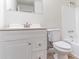 Bathroom features white vanity, mirror, toilet, and bathtub with shower at 4051 Ester Sw Dr, Atlanta, GA 30331