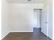 An empty bedroom features wood floors and a white door at 4051 Ester Sw Dr, Atlanta, GA 30331