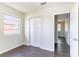 Bedroom features wood floors, a window, and closet with double doors at 4051 Ester Sw Dr, Atlanta, GA 30331