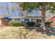 Charming single-story home with brick accents, well-maintained landscaping and a mature shade tree in the front yard at 4051 Ester Sw Dr, Atlanta, GA 30331
