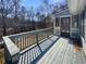 Inviting wooden back deck offers a relaxing outdoor space, perfect for enjoying nature at 8014 Bells Ferry Rd, Canton, GA 30114