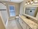 Bathroom featuring granite countertops, a shower-tub combination, and natural light at 8014 Bells Ferry Rd, Canton, GA 30114
