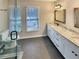 Stylish bathroom featuring a double vanity, modern fixtures, and a glass-enclosed shower at 8014 Bells Ferry Rd, Canton, GA 30114