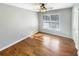 Cozy bedroom with hardwood floors and a window letting in plenty of natural light at 8014 Bells Ferry Rd, Canton, GA 30114