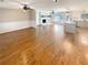 Open-concept living room with hardwood floors, fireplace, and seamless transition to the kitchen area at 8014 Bells Ferry Rd, Canton, GA 30114