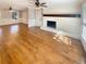 Spacious living room with fireplace and hardwood flooring provides a cozy atmosphere for gatherings and relaxation at 8014 Bells Ferry Rd, Canton, GA 30114