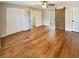 Spacious main bedroom with hardwood floors, closet space, and a stylish barn door leading to the en suite bathroom at 8014 Bells Ferry Rd, Canton, GA 30114