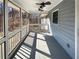 Screened-in porch with ceiling fans offers a cozy retreat with views of the outdoors at 8014 Bells Ferry Rd, Canton, GA 30114