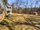 Large, grassy yard offers plenty of space for outdoor activities and enjoying nature at 8014 Bells Ferry Rd, Canton, GA 30114