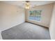 Bedroom features soft carpet and a window bringing in natural light at 1156 Madison Green Sw Ln, Mableton, GA 30126