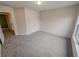 Cozy carpeted bedroom with neutral walls and a double door closet at 1156 Madison Green Sw Ln, Mableton, GA 30126