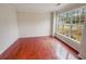 Light-filled room featuring hardwood floors and a large window at 1156 Madison Green Sw Ln, Mableton, GA 30126