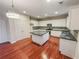 Spacious kitchen with white cabinets, stainless steel appliances, and a center island at 1156 Madison Green Sw Ln, Mableton, GA 30126