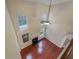 High angle shot of the living room features tall windows, a fireplace and wood flooring at 1156 Madison Green Sw Ln, Mableton, GA 30126