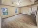 Generously sized primary bedroom features two large windows and a ceiling fan at 1156 Madison Green Sw Ln, Mableton, GA 30126