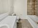 Bathroom featuring a tiled shower, tiled floor, tub and a vanity with sink at 1485 Riverrock Trl, Riverdale, GA 30296