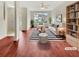 Bright, staged living room with modern decor, a striped rug, comfortable seating, and a view of the outdoors at 1485 Riverrock Trl, Riverdale, GA 30296