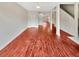 Bright living room featuring wood-look flooring, white ceiling fan and ample space for entertaining at 1485 Riverrock Trl, Riverdale, GA 30296