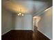 Open-concept dining room with hardwood floors, a chandelier, and access to other rooms at 1970 Old Dogwood, Jonesboro, GA 30238
