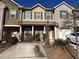 Charming townhome featuring a welcoming entryway, a private garage, and beautiful landscaping at 1970 Old Dogwood, Jonesboro, GA 30238