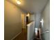 Hallway on the second floor featuring carpet flooring, gray walls and white doors at 1970 Old Dogwood, Jonesboro, GA 30238