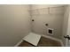 Functional laundry room area equipped with connections and overhead shelving for storage at 1970 Old Dogwood, Jonesboro, GA 30238