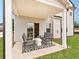 Covered patio area with stylish outdoor furniture at 363 Denali Butte Ter, Canton, GA 30114