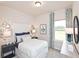 Cozy bedroom with a comfortable bed, ample natural light, and stylish decor at 363 Denali Butte Ter, Canton, GA 30114