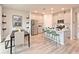 Modern kitchen with stainless steel appliances, white cabinets, and a breakfast bar with seating at 363 Denali Butte Ter, Canton, GA 30114