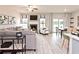 Open-concept living room with a fireplace, large windows, and hardwood floors at 363 Denali Butte Ter, Canton, GA 30114