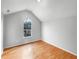 Bright bedroom with large window and light hardwood flooring at 4565 Bridle Point Pkwy, Snellville, GA 30039