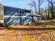 Backyard featuring lush greenery and a patio, offering a serene outdoor space at 5407 Effingham Ct, Lithonia, GA 30038