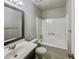 Clean bathroom with a shower-tub combo, white fixtures, and a modern vanity at 5407 Effingham Ct, Lithonia, GA 30038