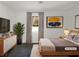 Cozy bedroom with soft lighting, neutral decor, a plush rug, and a serene atmosphere at 5407 Effingham Ct, Lithonia, GA 30038