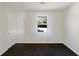 Neutrally painted bedroom with a window and carpet at 5407 Effingham Ct, Lithonia, GA 30038