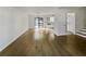 Spacious open-plan room featuring hardwood floors, dining area, adjacent kitchen and staircase at 5407 Effingham Ct, Lithonia, GA 30038
