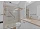 Updated bathroom with glass-enclosed shower, granite countertop, and modern fixtures at 1235 King Springs Se Ct, Smyrna, GA 30080
