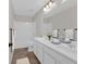 This bathroom features double sinks, a large mirror, and a shower-tub combo, creating a functional space at 1235 King Springs Se Ct, Smyrna, GA 30080