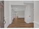 Bright foyer with hardwood floors and crisp white moldings that lead to an open concept living area at 1235 King Springs Se Ct, Smyrna, GA 30080
