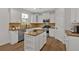 Bright, open kitchen with stainless steel appliances, granite countertops, and a central island for entertaining at 1235 King Springs Se Ct, Smyrna, GA 30080