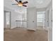 The loft provides a versatile space with neutral carpeting, natural light, and views of the staircase at 1235 King Springs Se Ct, Smyrna, GA 30080