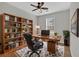 Functional office space with hardwood floors, a built-in bookshelf, and a spacious wooden desk at 1235 King Springs Se Ct, Smyrna, GA 30080
